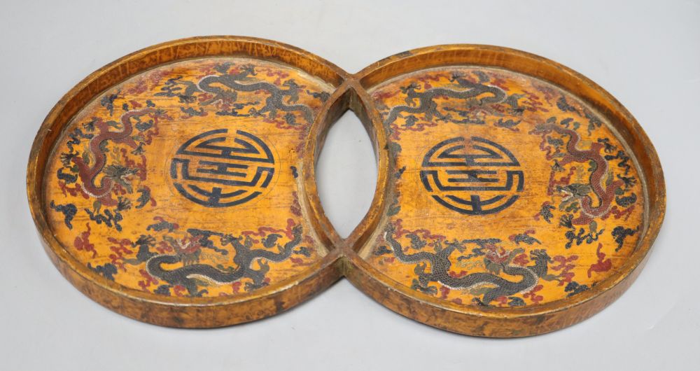 A 19th/20th century Chinese double circular wood and lacquer tray, length 42cm